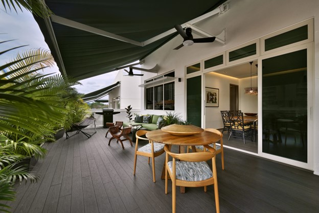 ALT Text: Modern luxury interior design - a balcony with lots of plants, wooden flooring showing connectivity with nature.